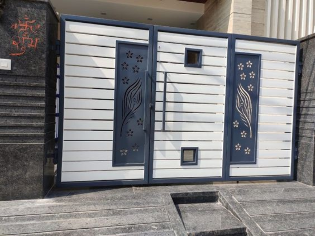 Durable steel gate with intricate design for main entrance.